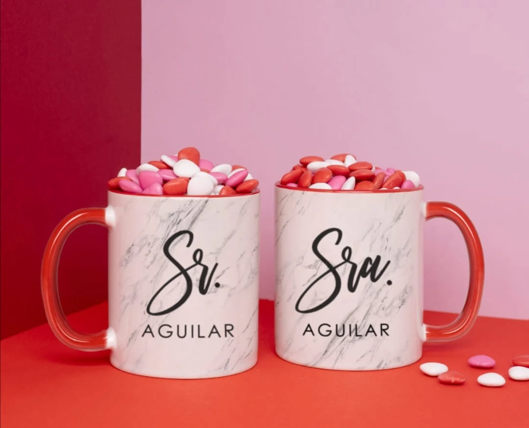 Pair of personalised mugs with a family name on a marble finish